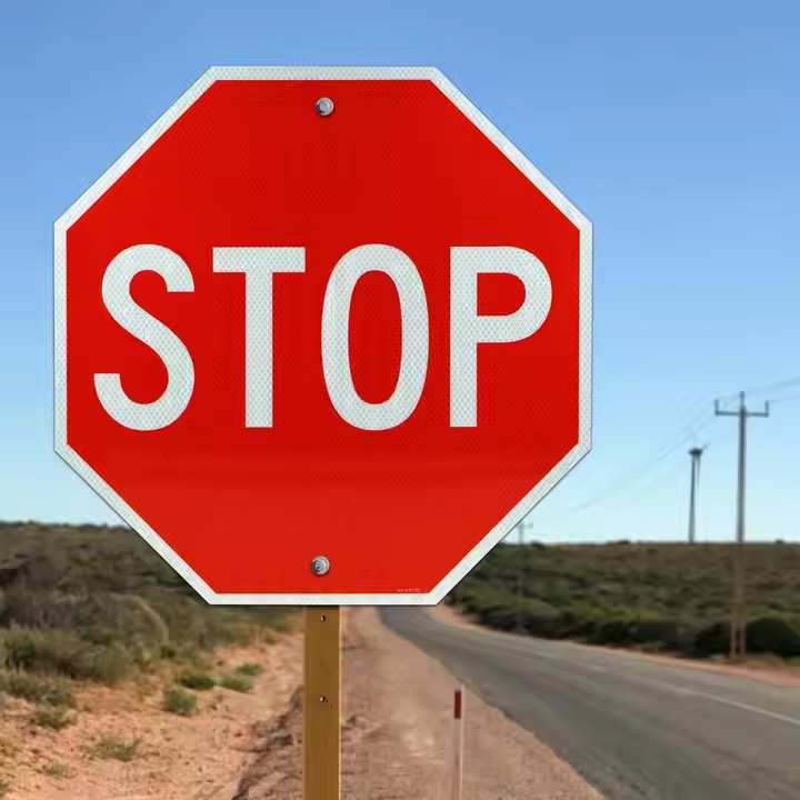 High-visibility custom STOP sign with reflective surface for road safety