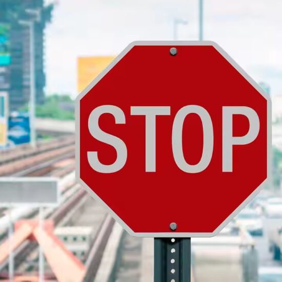 Durable octagonal STOP sign with reflective coating for traffic control