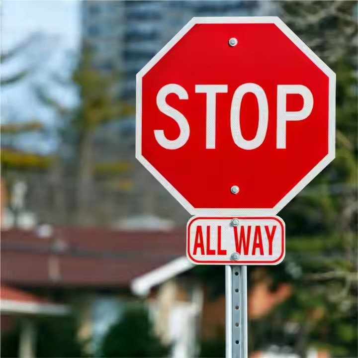 Anti-fade reflective STOP sign for outdoor traffic management