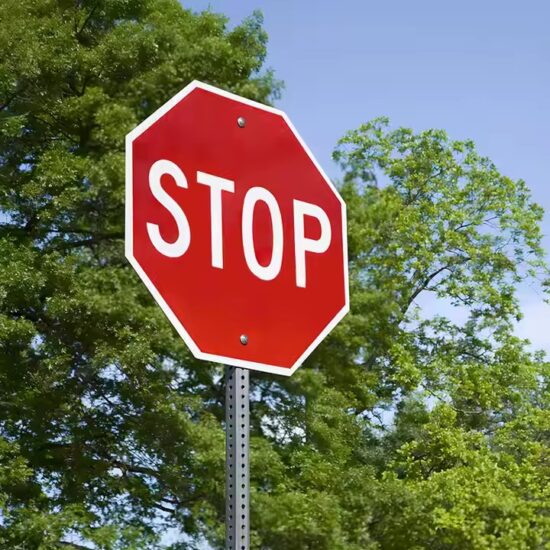 Anti-fade reflective STOP sign for outdoor traffic management