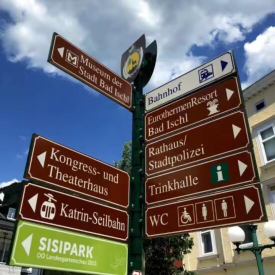 Custom outdoor road sign with reflective graphics installed on roadside